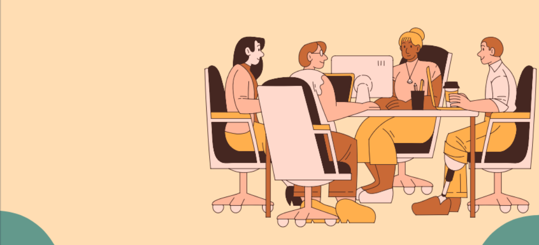 Employees sitting at a table in a meeting room discussing strategies for building a digitally savvy workforce.