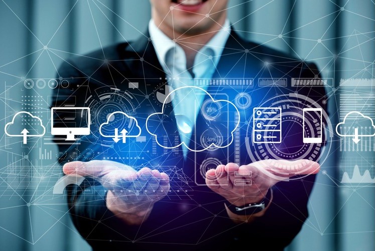 A business professional showcasing cloud-based solutions, emphasizing their benefits like agility, scalability, innovation, and security to enhance digital experiences and drive competitiveness.