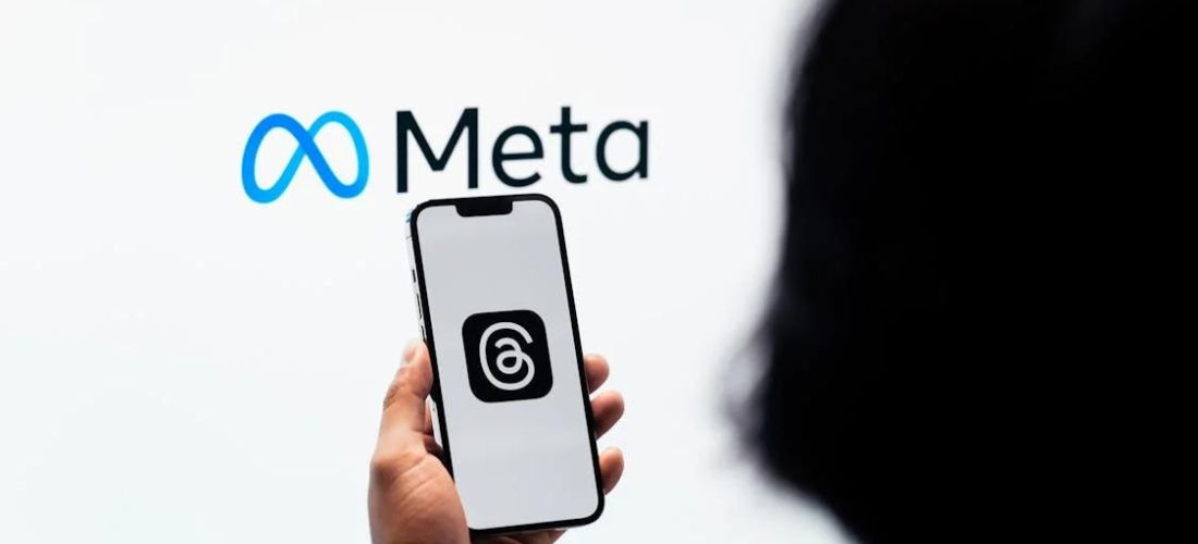 A person holds a smartphone displaying Meta's logo, highlighting the company's $1.4 billion settlement with Texas over biometric data privacy issues.