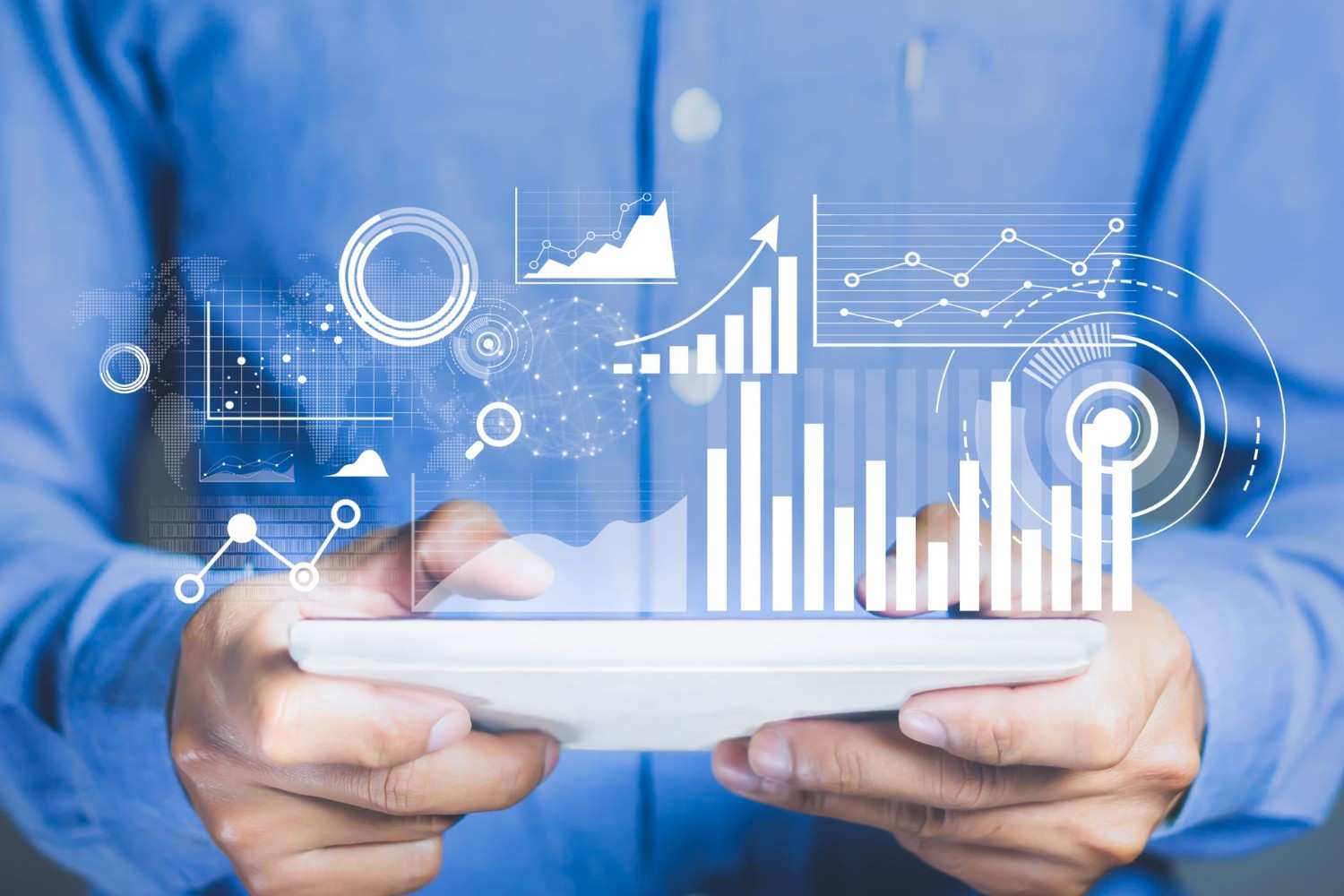 Business professional using predictive analytics on a tablet to analyze data trends and make informed decisions for growth and innovation.