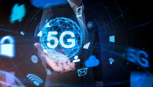  A businessman holding a holographic globe labeled "5G," symbolizing the transformation of CMS-driven digital experiences through enhanced speed and connectivity.